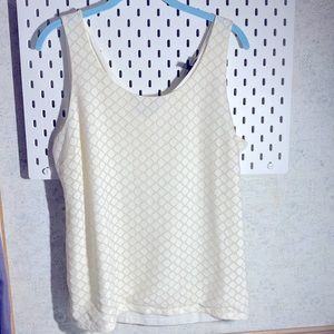 Cream colored tank with gold accents.